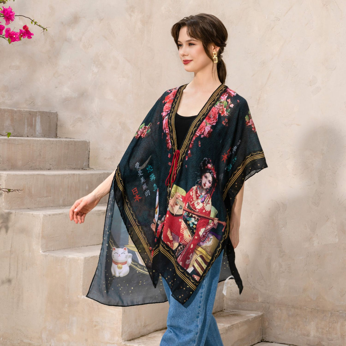 Woman in black top and blue jeans walking away wearing our Nicole Lee Kimono in our Akiko la Belleza design.