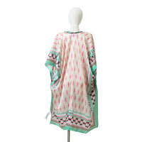 WHITE MANNEQUIN IN OUR PRINTED KIMONO IN GREEN BACK SIDE.
