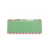 THE BOTTOM IS MADE OF VEGAN LEATHER IN A MINT GREEN COLOR.