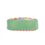THE BOTTOM IS MADE OF VEGAN LEATHER IN A MINT GREEN COLOR.