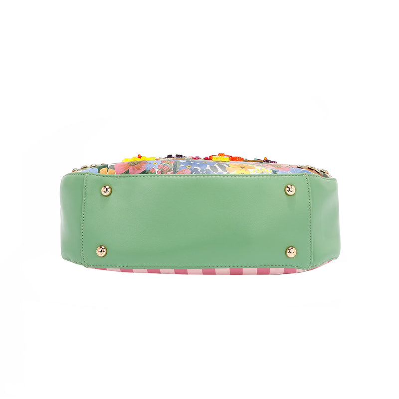 THE BOTTOM IS MADE OF VEGAN LEATHER IN A MINT GREEN COLOR.