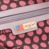 POCKET FROM THE INSIDE WITH THE NICOLE LEE PLAQUE