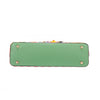 THE BOTTOM IS MADE OF VEGAN LEATHER IN A MINT GREEN COLOR.