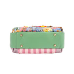 THE BOTTOM IS MADE OF VEGAN LEATHER IN A MINT GREEN COLOR.