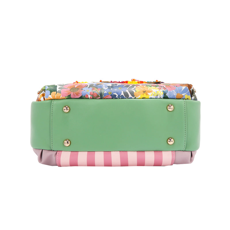 THE BOTTOM IS MADE OF VEGAN LEATHER IN A MINT GREEN COLOR.