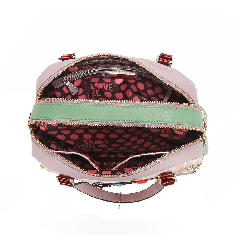 A VIEW FROM ABOVE, YOU CAN SEE THE COMPARMENTS AND THE POLKA DOT PRINTED POLYESTER INTERIOR LINING.