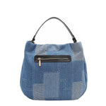 Back view of our denim hobo Bag in our Nicole Lee Bosque de Amor design with black handles and Cotton denim exterior with faux vegan leather accents.