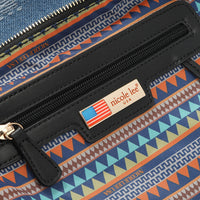Close-up of our Nicole Lee bag plaque.