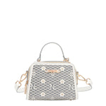 OUR MINI HANDBAG WITH LACER-CUT AND RHINESTONES DETAILS IN COLOR WHITE.