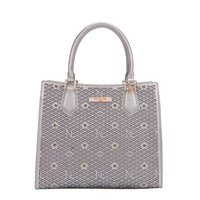 OUR GRACIE STRUCTURED TOTE WITH LACER-CUT AND RHINESTONES DETAILS IN COLOR PEWTER.