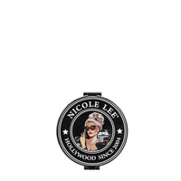 THE BACK OF THE MIRROR HAS THE NICOLE LEE SEAL IN OUR LADY IN BLACK DESIGN.