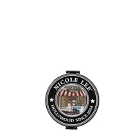 THE BACK OF THE MIRROR HAS THE NICOLE LEE SEAL , IN THE MIDDLE THERE'S 2 SCHNAUZER DOGS IN FRONT OF A COFFEE SHOP.