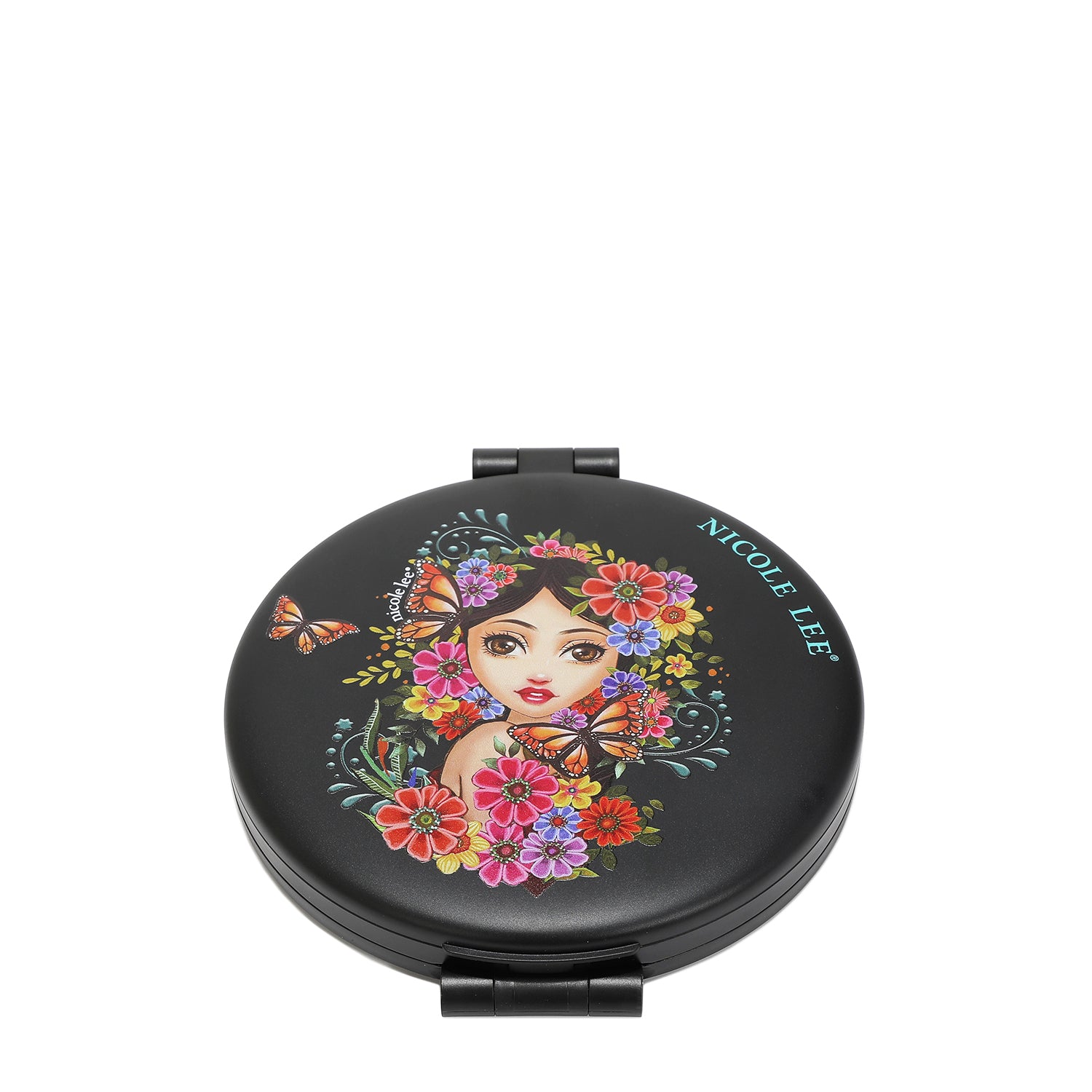 FRONT OF THE MIRROR HAS A BLACK BACKGROUND , IN THE MIDDLE IS A GIRL FACE WITH BLACK HAIR LOOKING AT YOU, SURROUNDED BY COLORFULL FLOWERS AND MONARCH BUTTERFLIES, WITH A SMALL NICOLE LEE LOG ON THE EDGE.