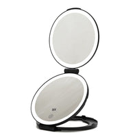 THE MIRROR IS OPEN, HAS DOUBLE MIRROR ,IT HAS LED LIGHTING THAT SURROUNDS EACH MIRROR WITH A SENSOR.