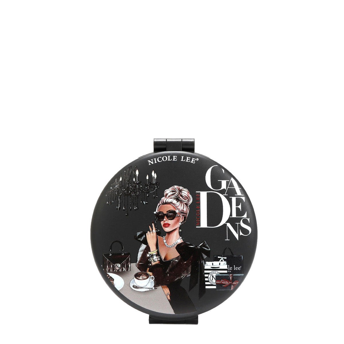 LADY IN BLACK , SHE IS WEARING A BLACK V NECK DRESS AND SUNGLASSES. SITTING IN A TABLE WITH A CUP OF COFFEE AND HAS HER HANDBAG ON THE TABLE. IN THE BACKGROUND THERE IS A CHANDELIER AND SOME NICOLE LEE SHOPPING BAGS