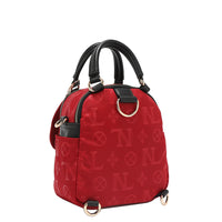 OUR NICOLE LEE MARGOT MULTI-WEAR DOME BAG IN RED. THE BACK HAS D-RINGS FOR BACKPACK OR CROSSBODY WEAR.