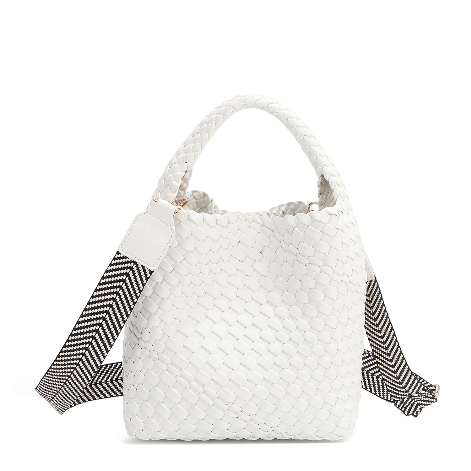 Introducing Juni from Nodu Nadu by Nicole Lee, a versatile and slouchy chic handbag with a removable pouch inside. Crafted in braided vegan leather with an optional, adjustable chevron striped shoulder strap for varied carrying options so you can wear it across the body or by the top handle for a sleek look. Pictured in a classic, timeless white shade with a black and white tonal striped shoulder strap.