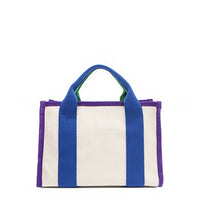 Back of the Rowan bag by Nodu Nadu by Nicole Lee. A bold mix of colors like vivid green, electric blue and vibrant purple trim evoke a sense of fun and lots of personality to mix and match your style. Dual top handles with a 3" drop allow you to carry this statement bag by the top handles. Pictured in classic beige that compliments any look, regardless of the season. 