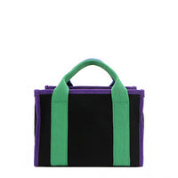Back of the Rowan Nodu Nadu by Nicole Lee handbag with green and purple trim and strap accents. Made of sturdy, lightweight, and durable canvas/polyester and designed to compliment any look, from day to night, regardless of the season!