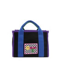 Why settle for one color when you can have them all? The small Rowan polyester bag brings the fun with bold color-block trim and mix-and-match straps—because your style deserves options! Available in classic black with bold blue and purple accents and a checker print smiley face adorned embroidered logo patch on the front. 