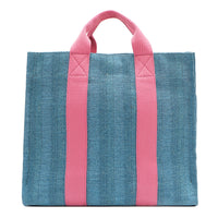 Back view of the Nodu Nadu Sawyer Bag in Blue with baby pink strap accents. Durable, canvas material in a rectangular silhouette offers endless expression to mix and match your style no matter the season or occasion. 