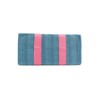 Rectangular bottom angle of the Nodu Nadu Sawyer Bag in Blue with baby pink webbed strap details. Made of durable canvas for long-lasting style.
