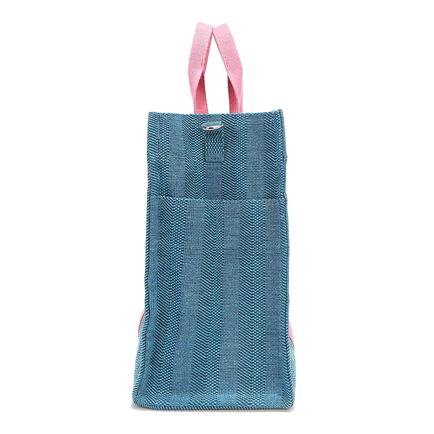 Rectangular side profile of the Nodu Nadu Sawyer Bag in Blue. Crafted in durable canvas with side D-rings for optional shoulder strap attachment so you can wear this bag as a handbag, shoulder bag, or crossbody! It also features side slip pockets for a convenient touch. 