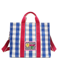 Your new go-to bag with a gingham twist! The Nodu Nadu Blair Bag in Blue brings a perfect mix of timeless charm and everyday durability, featuring a structured yet roomy silhouette, handy side pockets, and a back slip compartment to keep your essentials effortlessly organized. Pictured with the optional, adjustable shoulder strap attached for varied carrying options and versatility when wearing. 