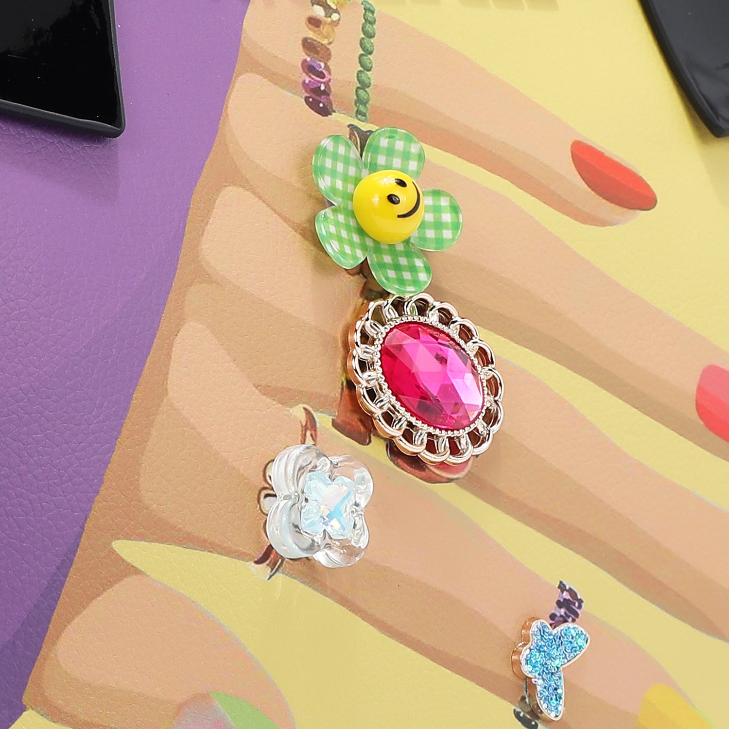 OUR NAIL POLISH HOBO BAG FRONT IS EMBELLISHED WITH RESIN FLOWERS, GEMS, AND JEWELS