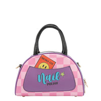 THE BACK OF OUR NAIL POLISH MINI DOME BAG IN A PINK CHECKER PRINT AND HAS A BACK  PURPLE SLIP POCKET.
