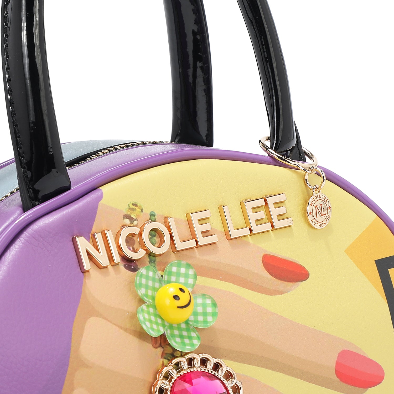 CLOSER LOOK TO OUR LOGO HARDWARE LETTERING IN OUR NAIL POLISH MINI DOME BAG. 
