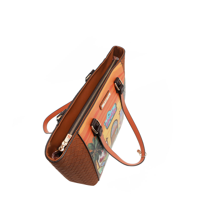 Our Sun and Sand Brown leather handbag with a tropical pattern set on a white background