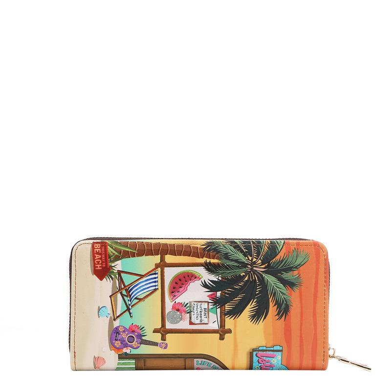 Our Nicole Lee sun and Sand wallet with tropical design featuring palm trees and beach elements  set on a white background.