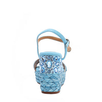 The platform wedge is adorned with blue rhinestones and  braid detailing.