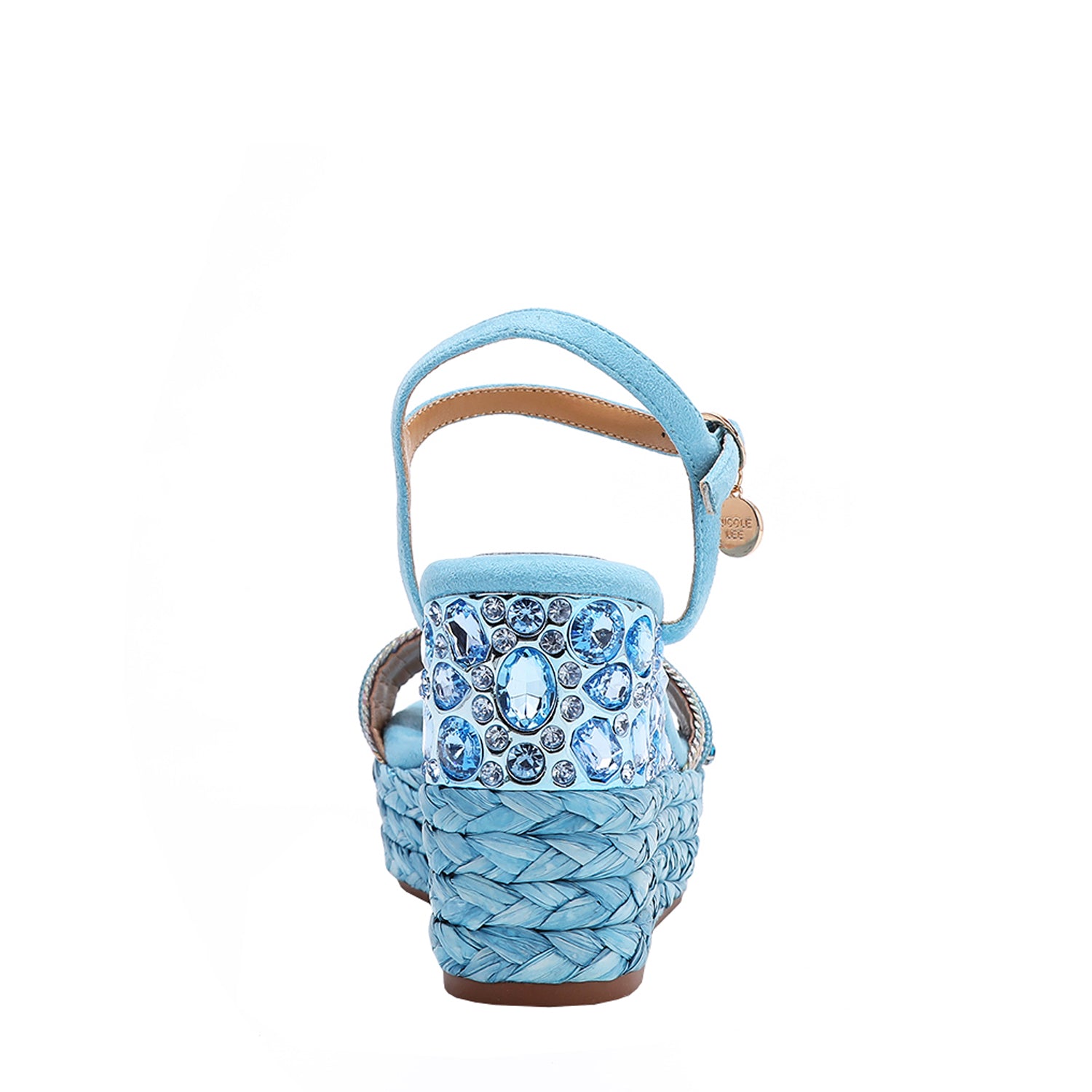 The platform wedge is adorned with blue rhinestones and  braid detailing.
