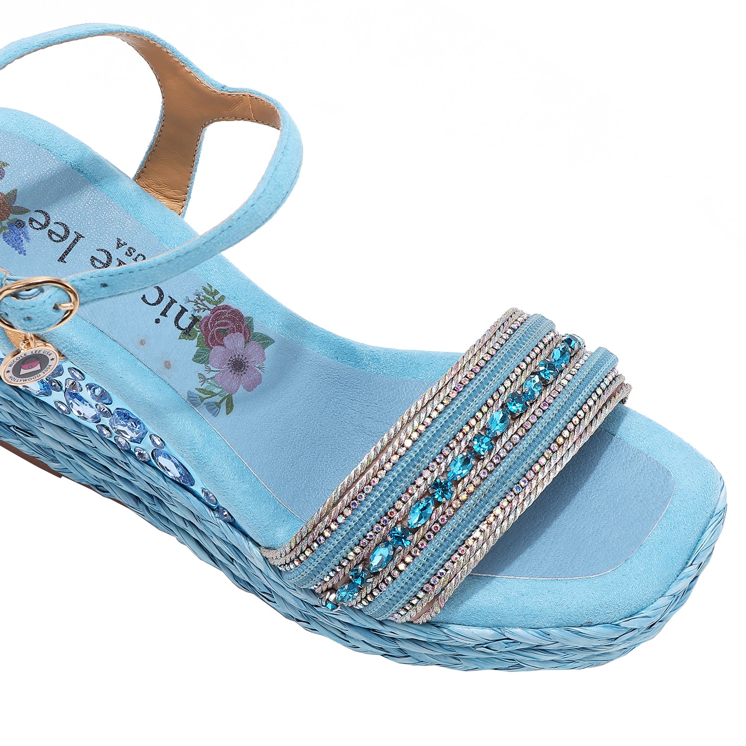 Kali Espadrille Wedge sandal in blue.  Fitted with 1 adjustable buckle. .The insole is gold with the Nicole Lee logo. Top strap is embellished with rhinestones.