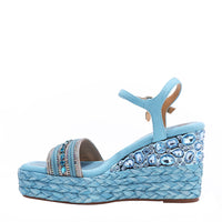 Kali Espadrille Wedge sandal in blue.  Fitted with 1 adjustable buckle. The buckle has a small Nicole Lee Charm.The wedge is adorned with rhinestones and  braid detailing.