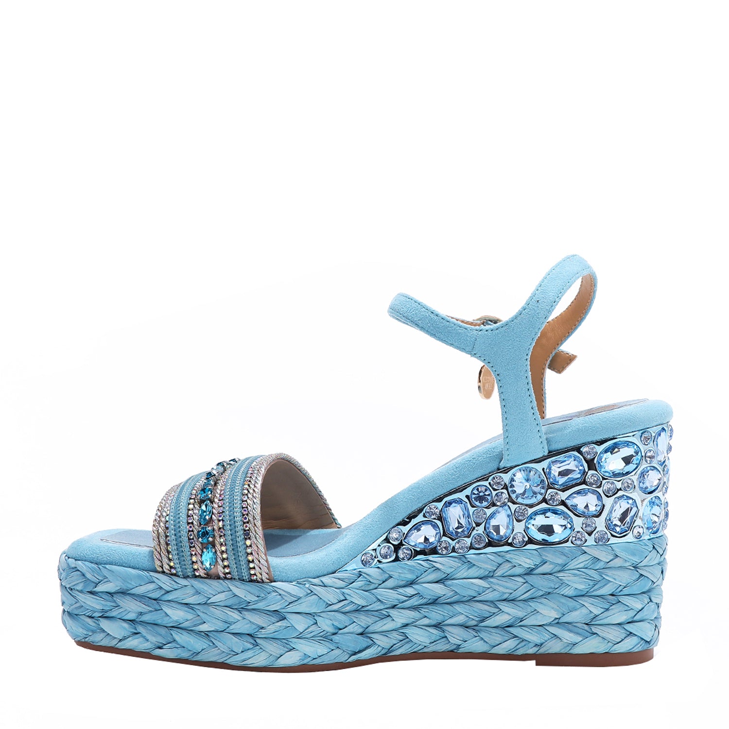Kali Espadrille Wedge sandal in blue.  Fitted with 1 adjustable buckle. The buckle has a small Nicole Lee Charm.The wedge is adorned with rhinestones and  braid detailing.