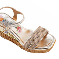 Kali Espadrille Wedge sandal in gold.  Fitted with 1 adjustable buckle. .The insole is gold with the Nicole Lee logo. Top strap is embellished with rhinestones.
