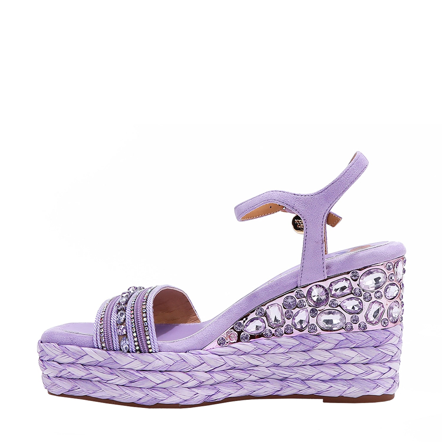 Kali Espadrille Wedge sandal in Purple.  Fitted with 1 adjustable buckle. The buckle has a small Nicole Lee Charm.The wedge is adorned with rhinestones and  braid detailing.