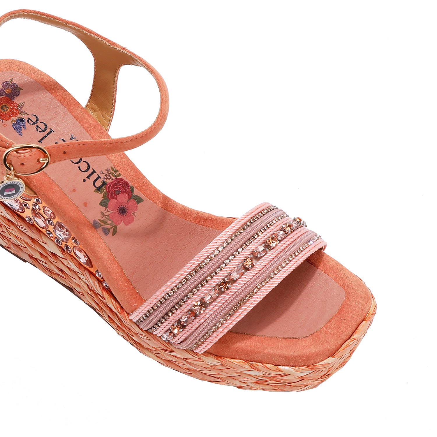 Kali Espadrille Wedge sandal in pink.  Fitted with 1 adjustable buckle. .The insole is pink with the Nicole Lee logo. Top strap is embellished with rhinestones.