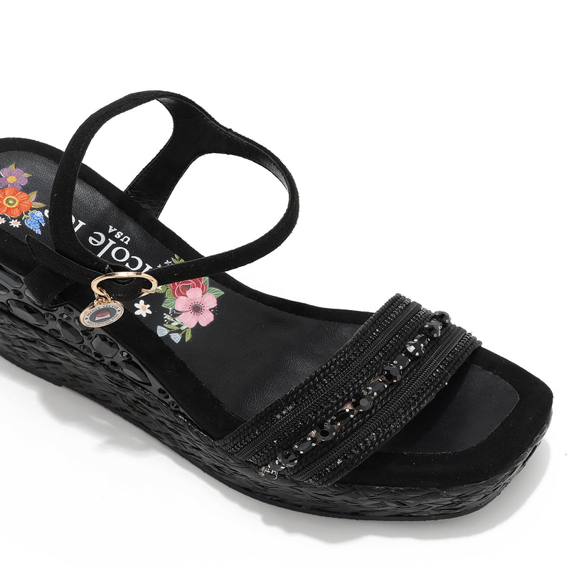 Kali Espadrille Wedge sandal in black.  Fitted with 1 adjustable buckle. .The insole is gold with the Nicole Lee logo. Top strap is embellished with rhinestones.