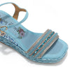 Kali Espadrille Wedge sandal in blue.  Fitted with 1 adjustable buckle. .The insole is gold with the Nicole Lee logo. Top strap is embellished with rhinestones.