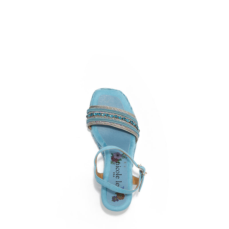 Kali Espadrille Wedge sandal in blue.  Fitted with 1 adjustable buckle. .The insole is purple with the Nicole Lee logo. The edge is velvet.
