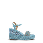 Kali Espadrille Wedge sandal in blue.  Fitted with 1 adjustable buckle. The buckle has a small Nicole Lee Charm.The wedge is adorned with rhinestones and  braid detailing.