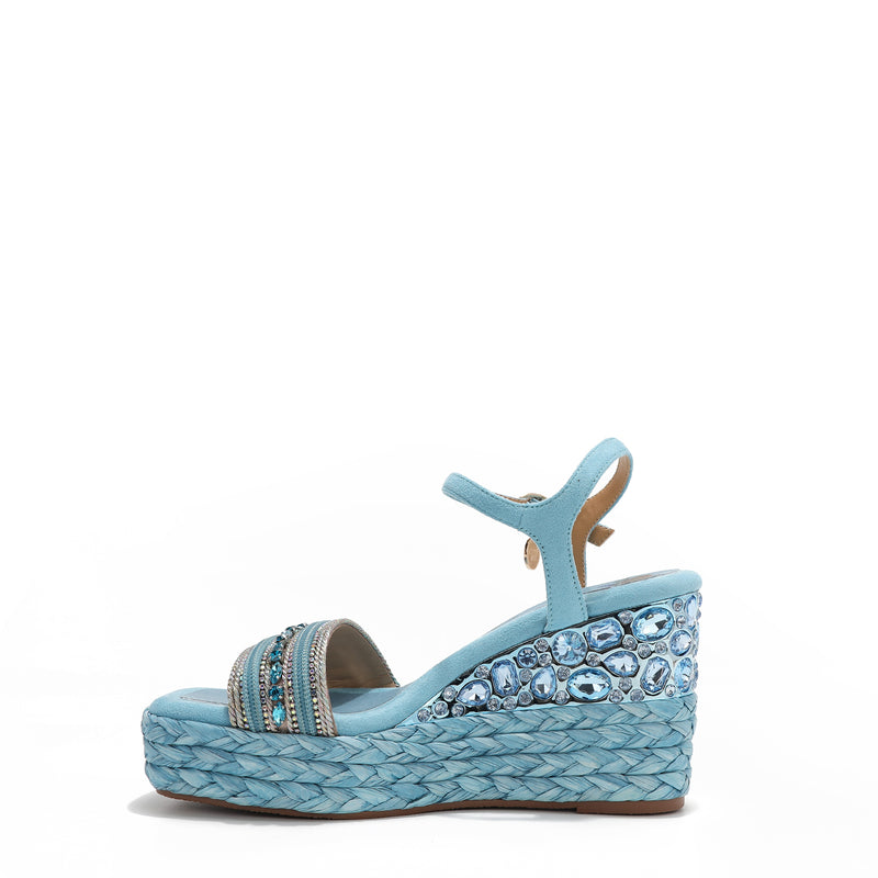 Kali Espadrille Wedge sandal in Purple.  Fitted with 1 adjustable buckle. The buckle has a small Nicole Lee Charm.The wedge is adorned with rhinestones and  braid detailing.