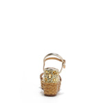 The platform wedge is adorned with gold yellow rhinestones and  braid detailing.