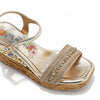 Kali Espadrille Wedge sandal in gold.  Fitted with 1 adjustable buckle. .The insole is gold with the Nicole Lee logo. Top strap is embellished with rhinestones.