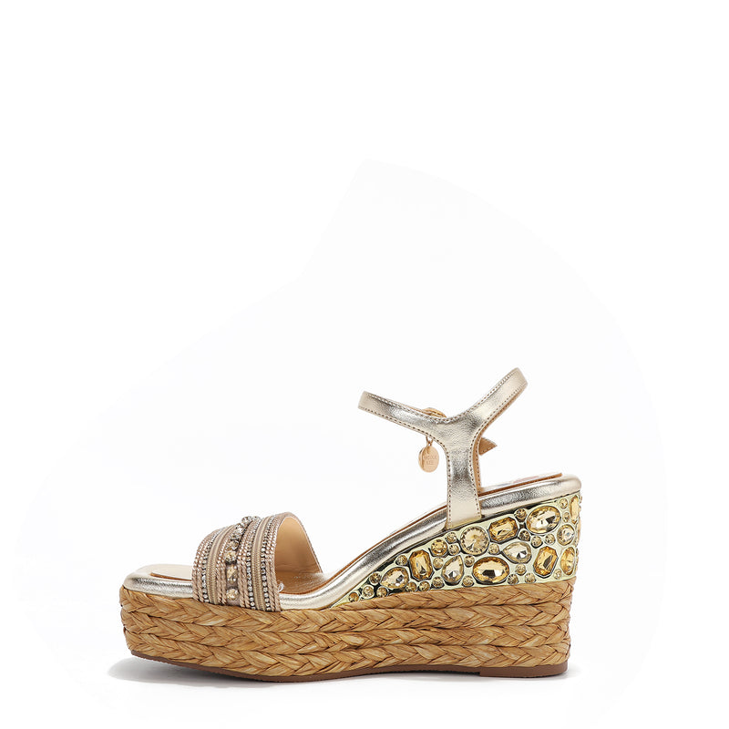 Kali Espadrille Wedge sandal.  Fitted with 1 adjustable buckle. The buckle has a small Nicole Lee Charm. The wedge is adorned with rhinestones and  braid detailing.