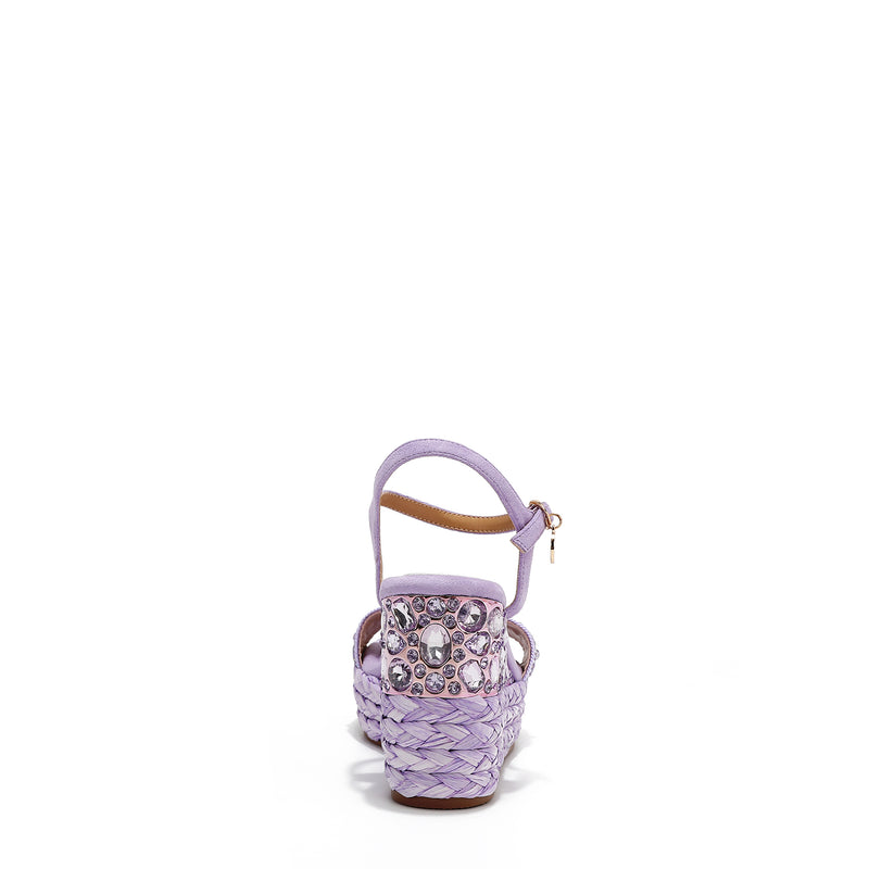 The platform wedge is adorned with purple rhinestones and  braid detailing.